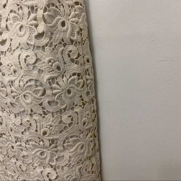 Ivory lace dress by Michael Kors is in like new condition. Size 2 - Picture 10 of 16